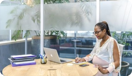 A businesswoman working at her desk.