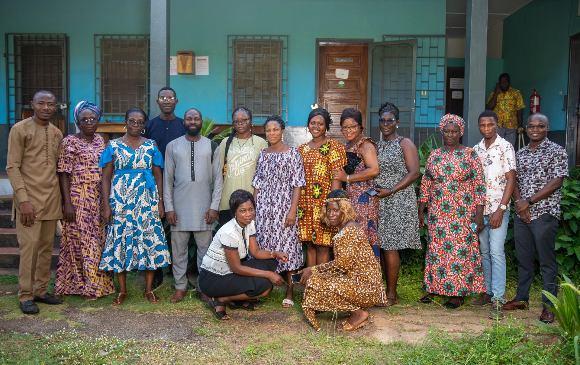 A group of women and men posing for a group photo