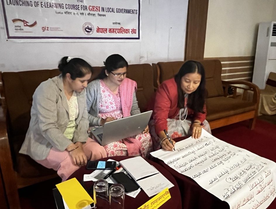 Thre women sitting together working