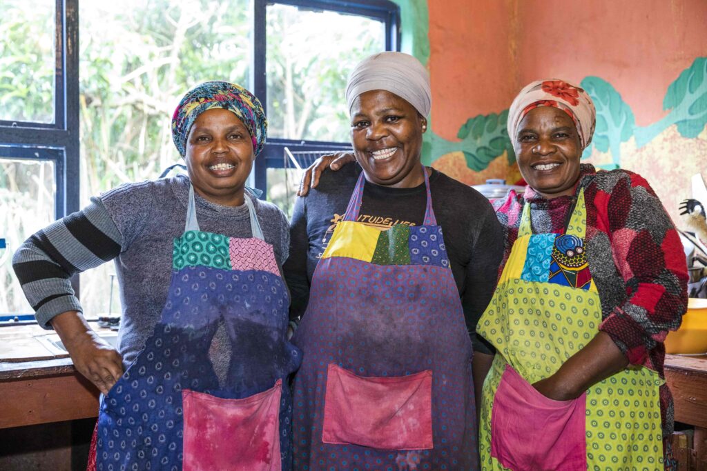 Three ladies posing for a photo.