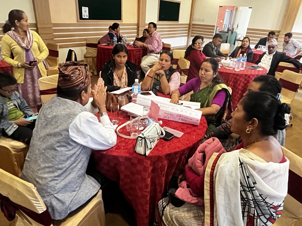 Group of people sitting together on a table